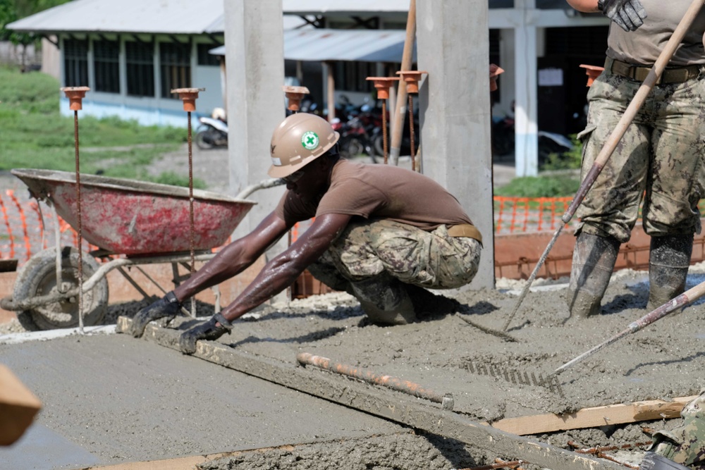 U.S. Navy Seabees deployed with NMCB-5’s Detail Timor-Leste build a three-room schoolhouse in Liquica, Timor-Leste