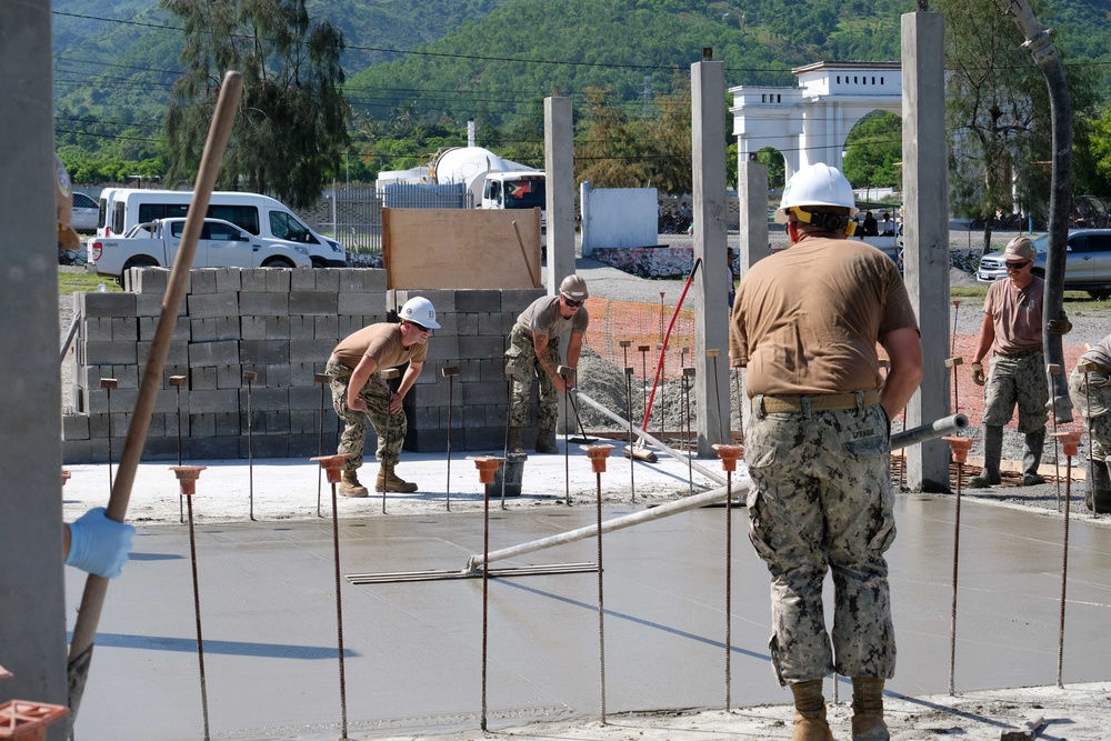 U.S. Navy Seabees deployed with NMCB-5’s Detail Timor-Leste build a three-room schoolhouse in Liquica, Timor-Leste