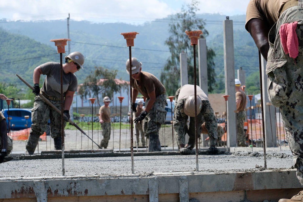 U.S. Navy Seabees deployed with NMCB-5’s Detail Timor-Leste build a three-room schoolhouse in Liquica, Timor-Leste