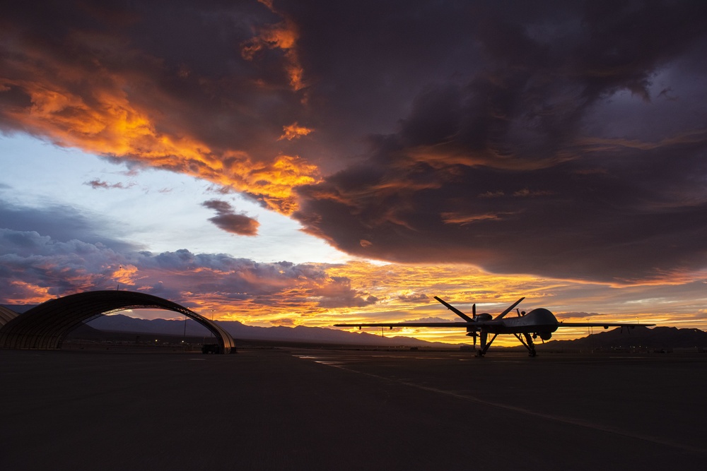 MQ-9 Reaper and aircrew underneath Nevada sunset