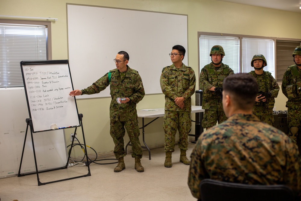 Iron Fist 2020: Japanese Ground Self Defense Force soldiers demonstrate combat medical care procedures to U.S. Sailors.