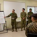 Iron Fist 2020: Japanese Ground Self Defense Force soldiers demonstrate combat medical care procedures to U.S. Sailors.