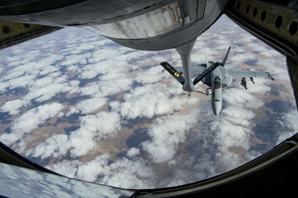 A U.S. Air Force KC-135 aircrew assigned to the 28th Expeditionary Air Refueling Squadron conducts aerial refueling over Afghanistan.