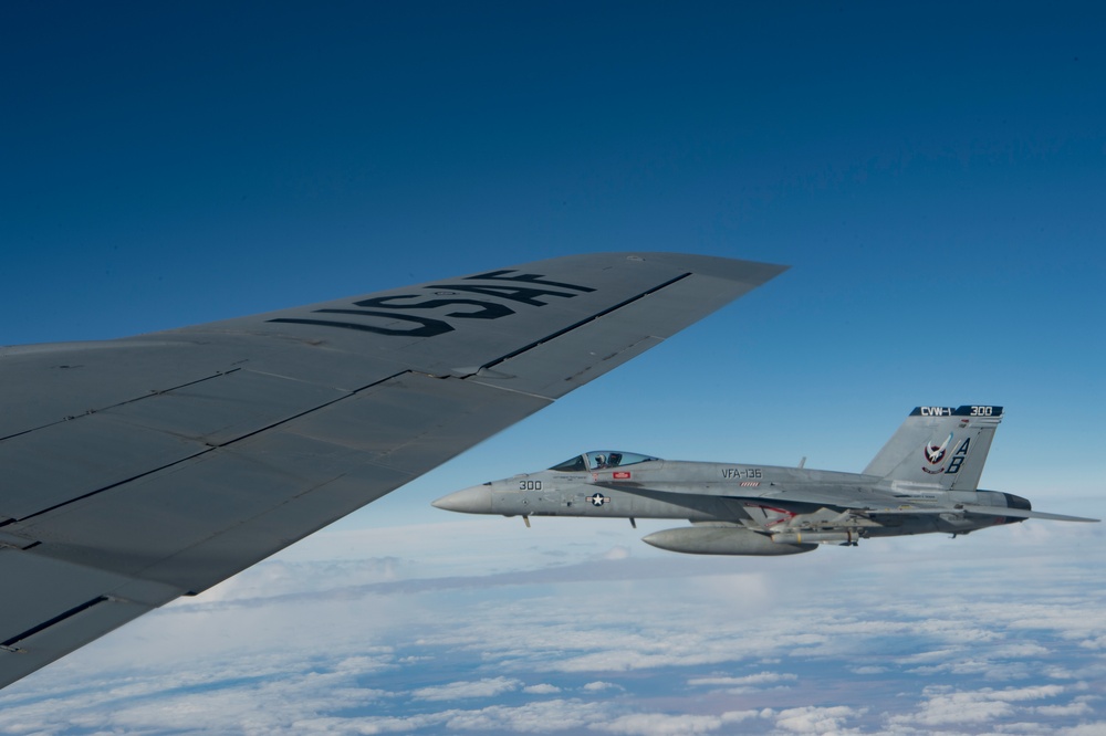 A U.S. Air Force KC-135 aircrew assigned to the 28th Expeditionary Air Refueling Squadron conducts aerial refueling over Afghanistan.