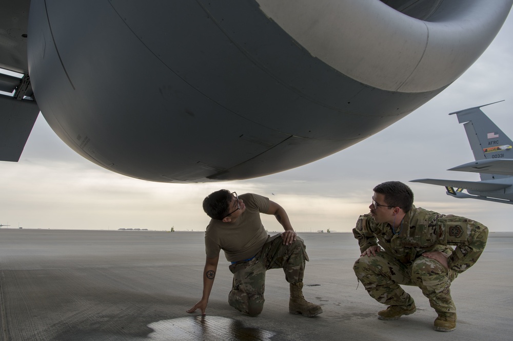 A U.S. Air Force KC-135 aircrew assigned to the 28th Expeditionary Air Refueling Squadron conducts aerial refueling