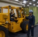 Sailors move cargo in the well deck of New York.