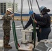 Sailors and Marines unload cargo