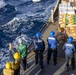 New York recieves cargo from replenishment ship