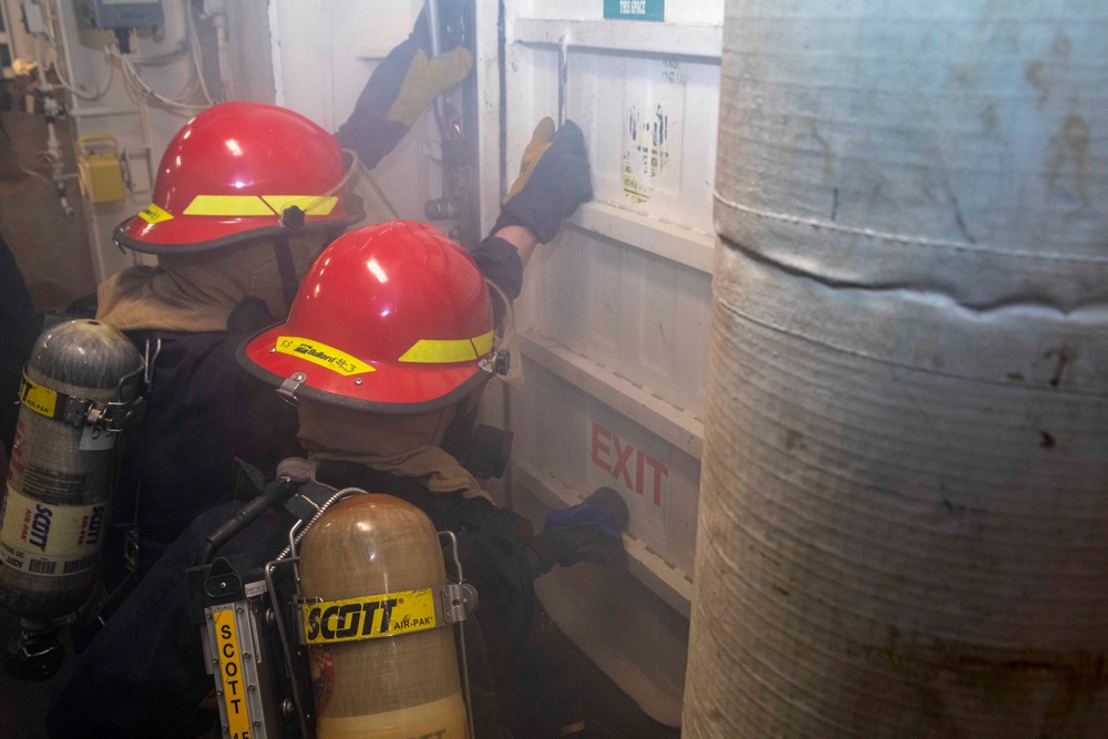 Sailors prepare to fight a simulated fire