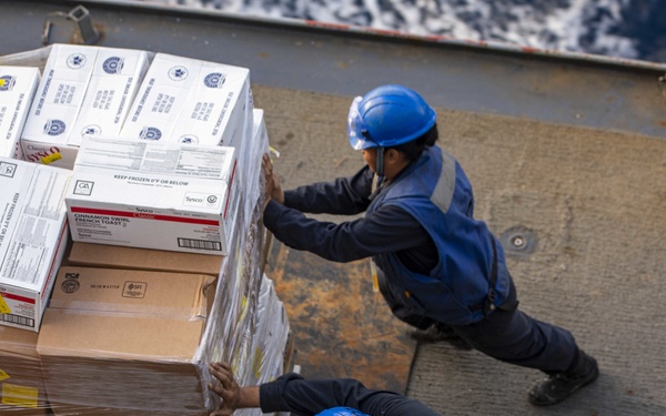 Sailors move supplies