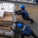 Sailors move supplies
