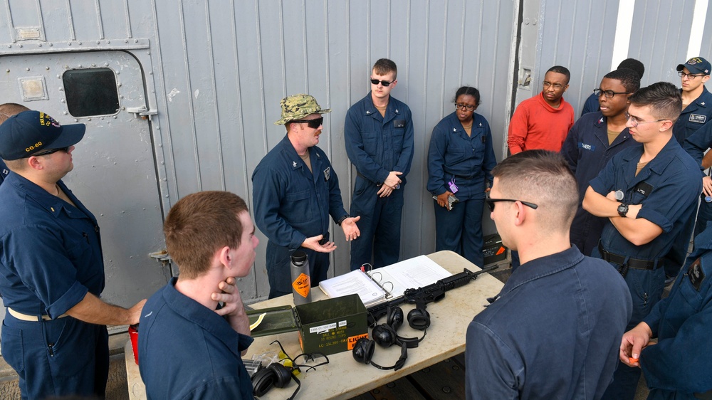USS Normandy Sailor Gives Weapons Familiarization Training