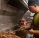 Sailors cook in the galley