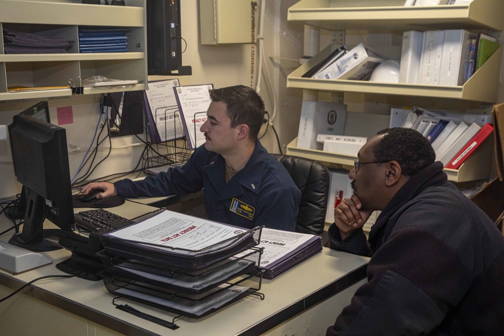 Sailors work in the admin department