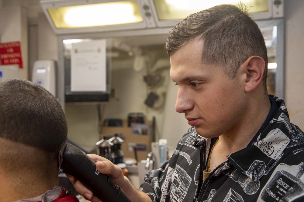 Sailor cuts hair