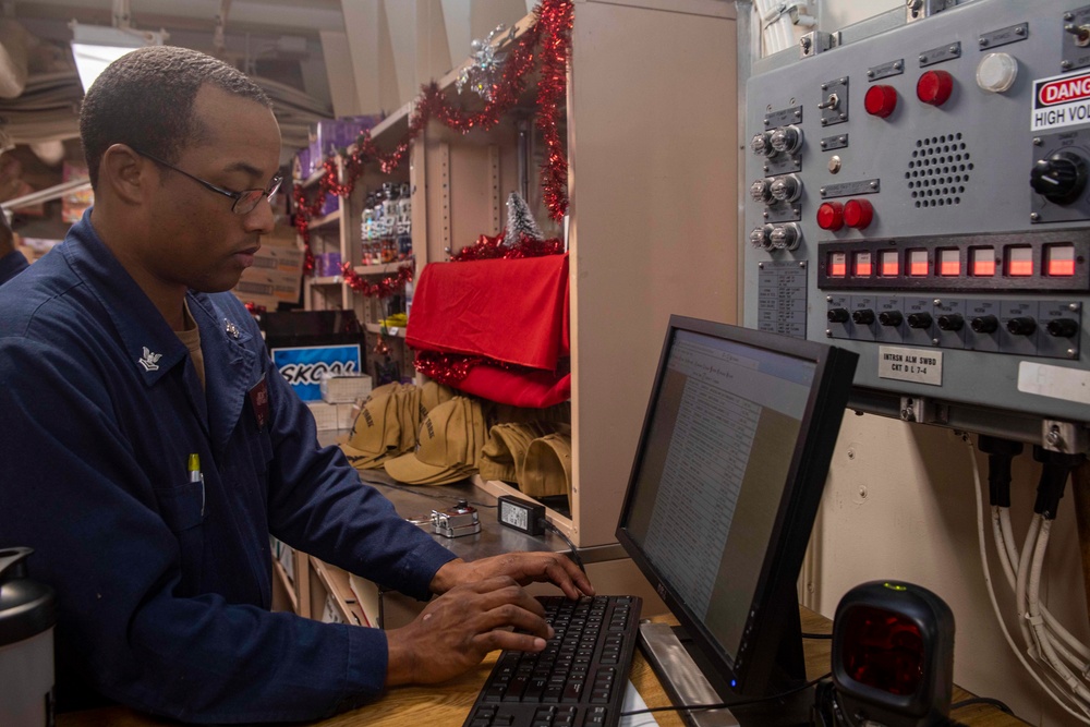 Sailors work in the ship store