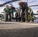 Sailors take part in flight deck fire fighting