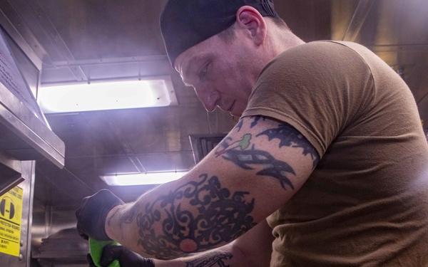 Sailor decorates cookies