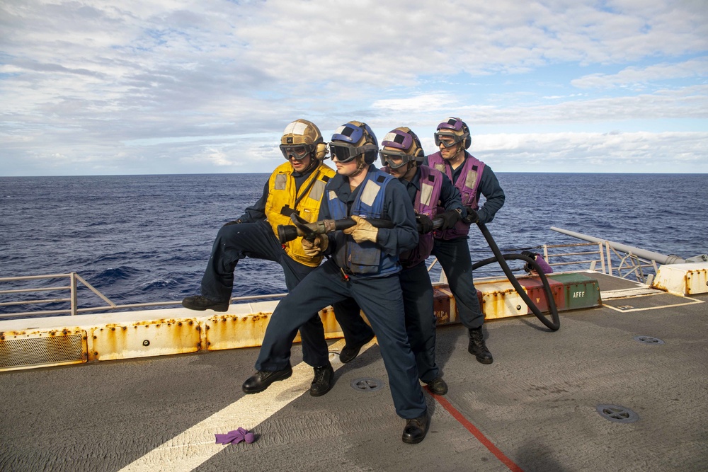 Sailors take part in flight deck fire fighting