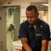 Corpsman keeps pressure on simulated wound