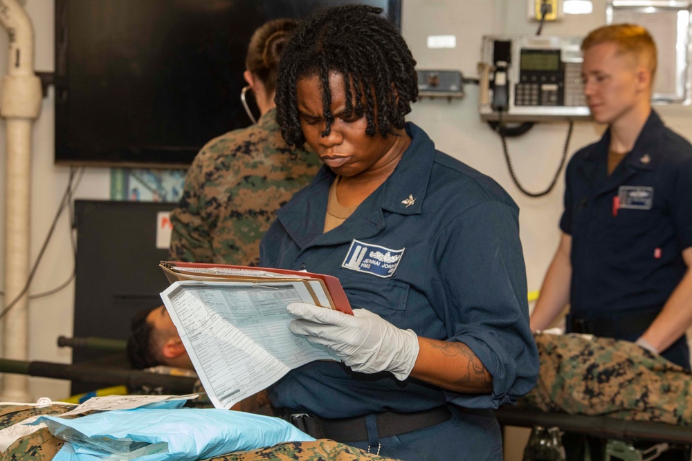 Corpsman looks over chart