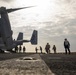 Sailors and Marines move supplies