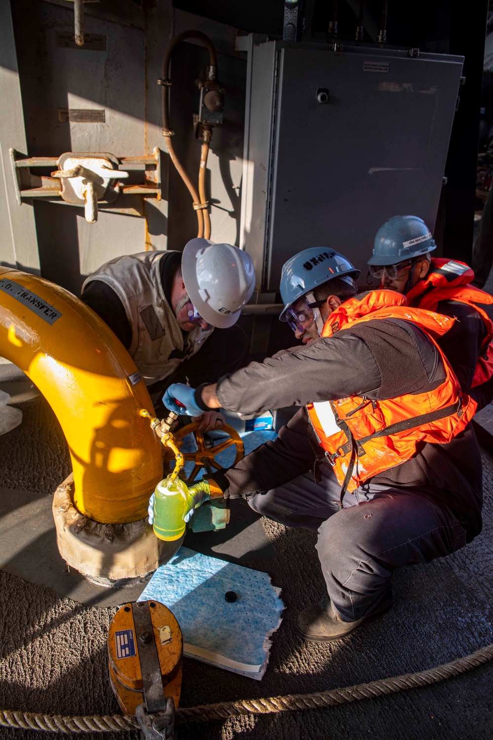 Sailors take fuel samples