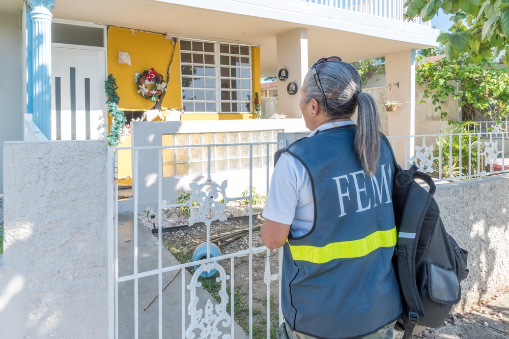 Disaster Assistance Team Member Canvasses Nieghborhoods After Quake