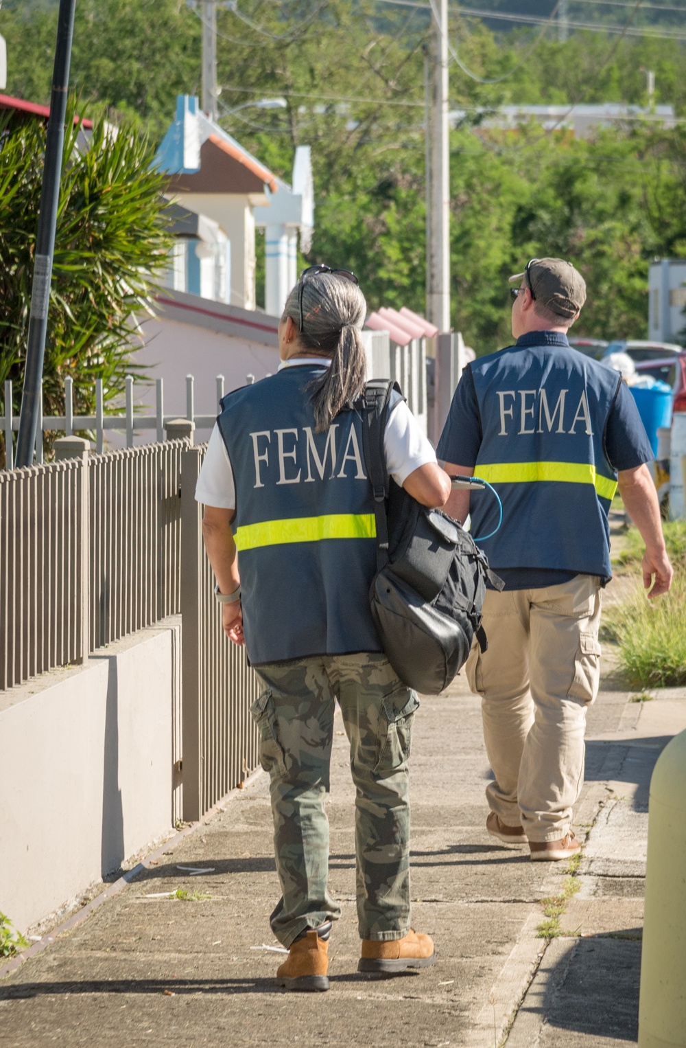Disaster Assistance Team Members Canvass Neighborhoods After Quake