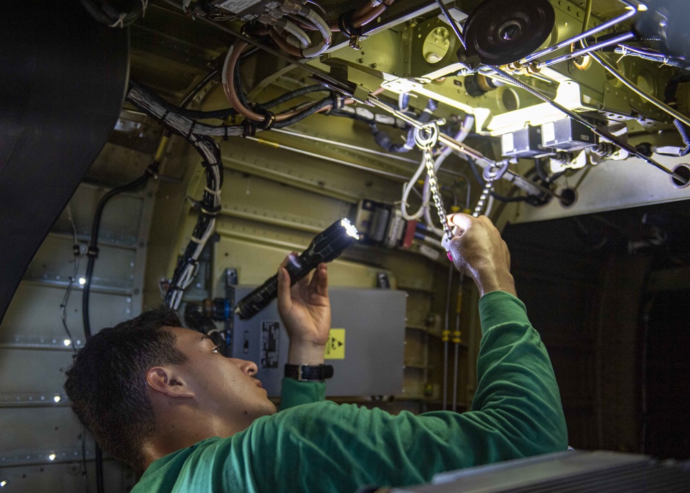 USS Normandy Sailor Reattaches Flight Control Cables on MH-60R