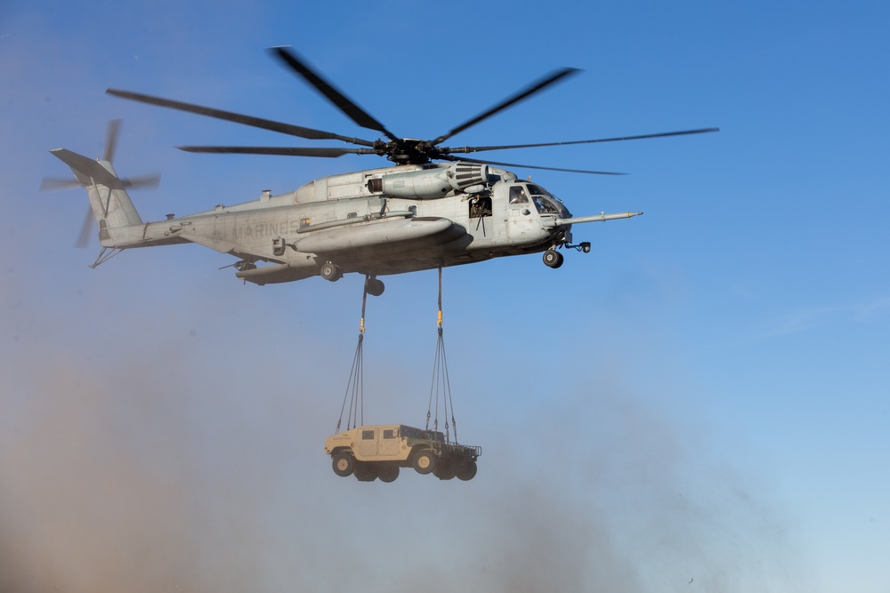 HMH-461 Marines shoot M2 machine guns and externally lift Humvees