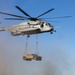 HMH-461 Marines shoot M2 machine guns and externally lift Humvees