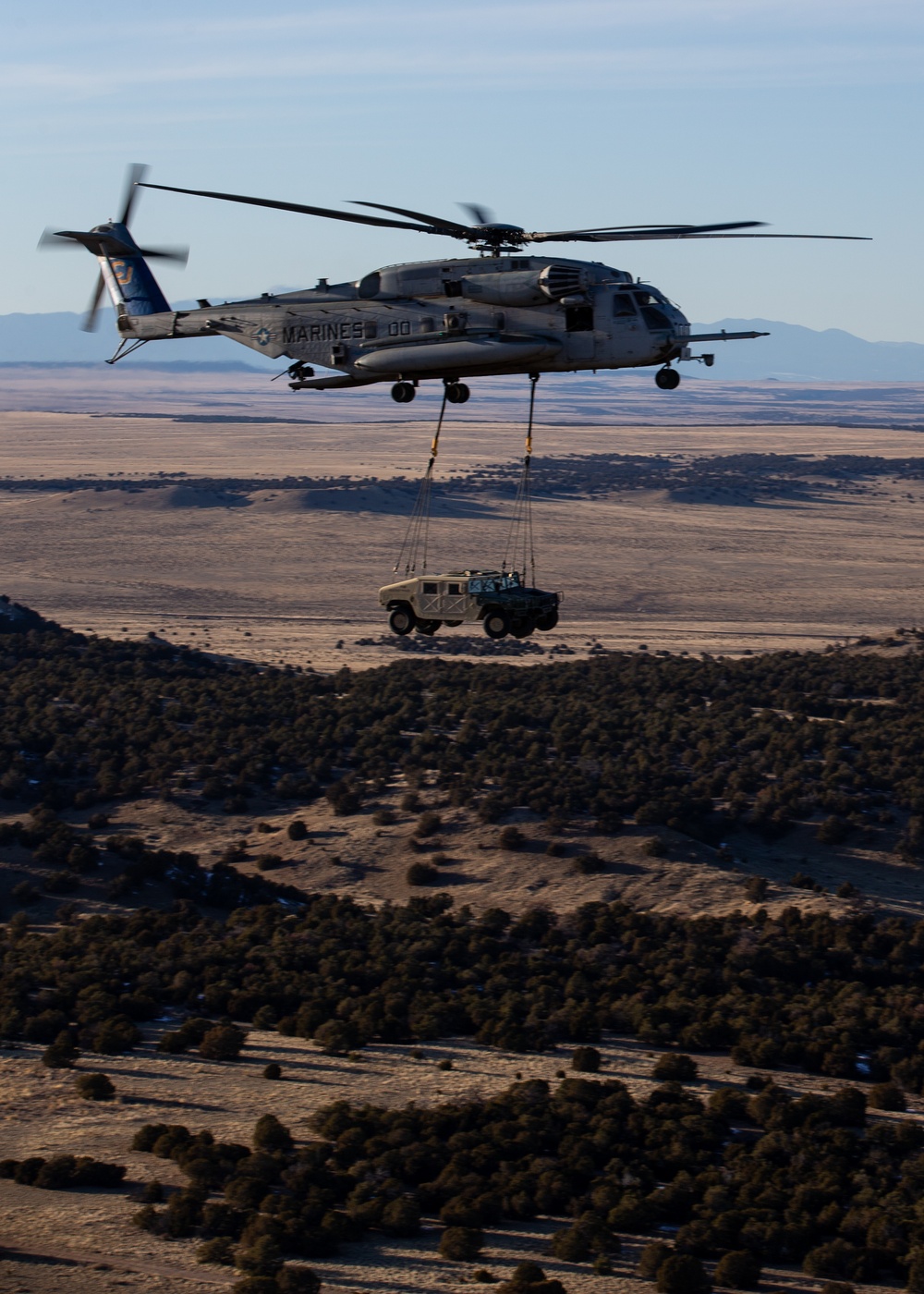 HMH-461 Marines shoot M2 machine guns and externally lift Humvees