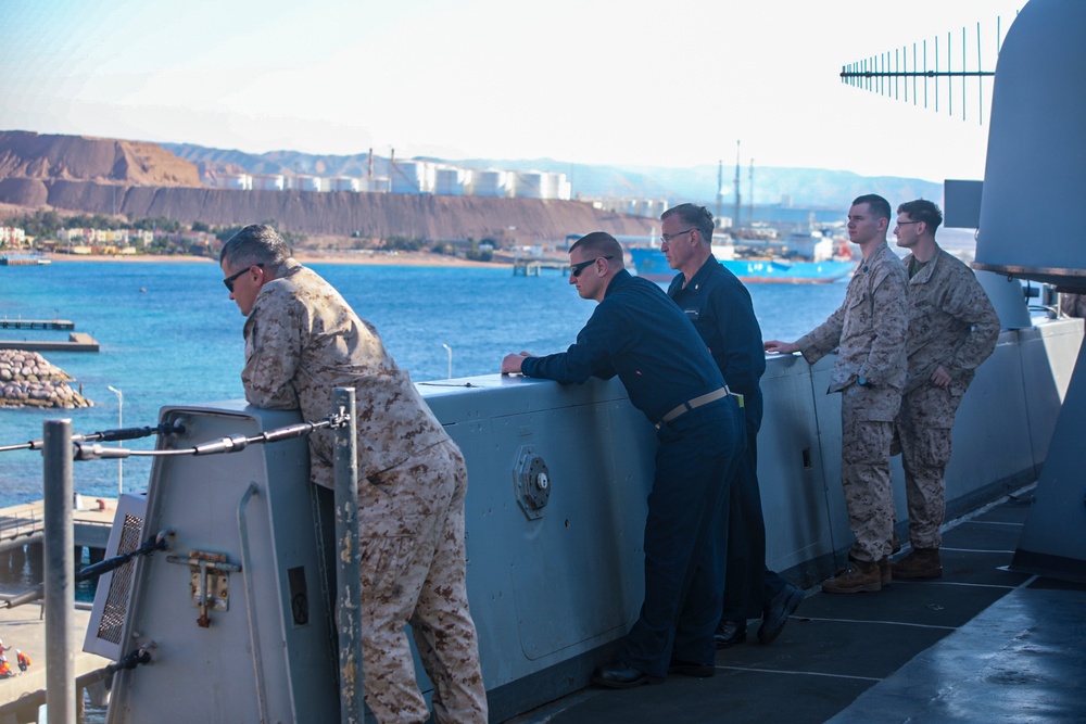 Sailors and Marine watch New York pull into Aqaba, Jordan