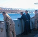 Sailors and Marine watch New York pull into Aqaba, Jordan