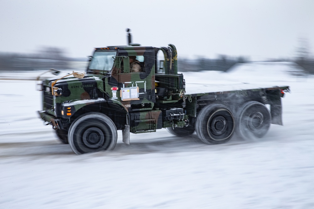 Drive Hard | U.S. Marines assigned to the Logistics Command Element maneuver vehicles through snow, harsh terrain