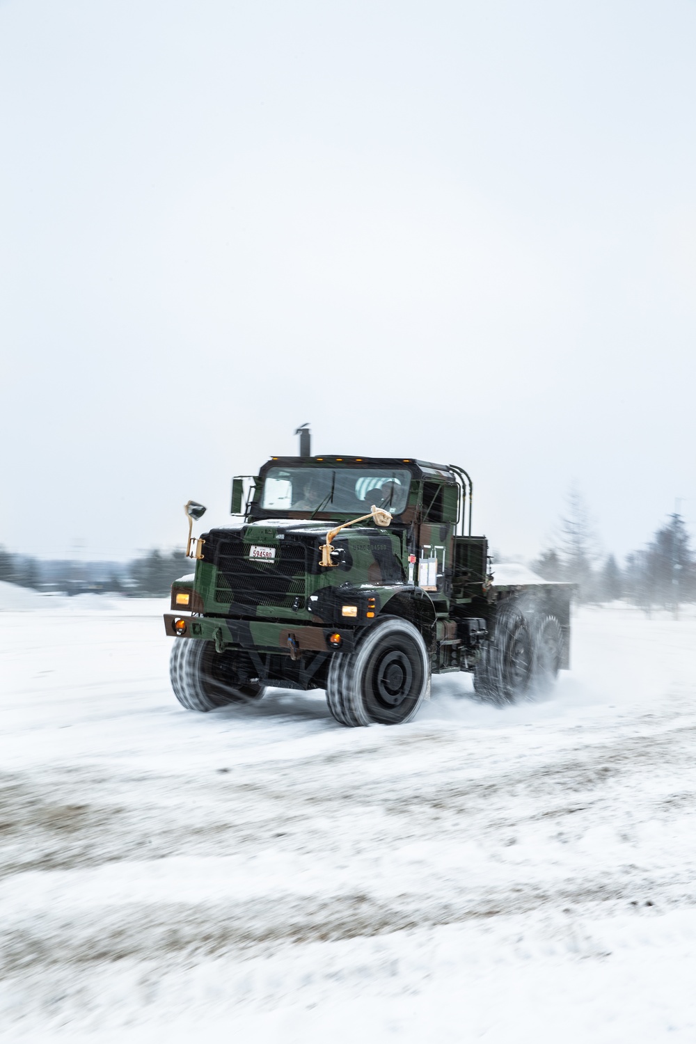 Drive Hard | U.S. Marines assigned to the Logistics Command Element maneuver vehicles through snow, and harsh terrain