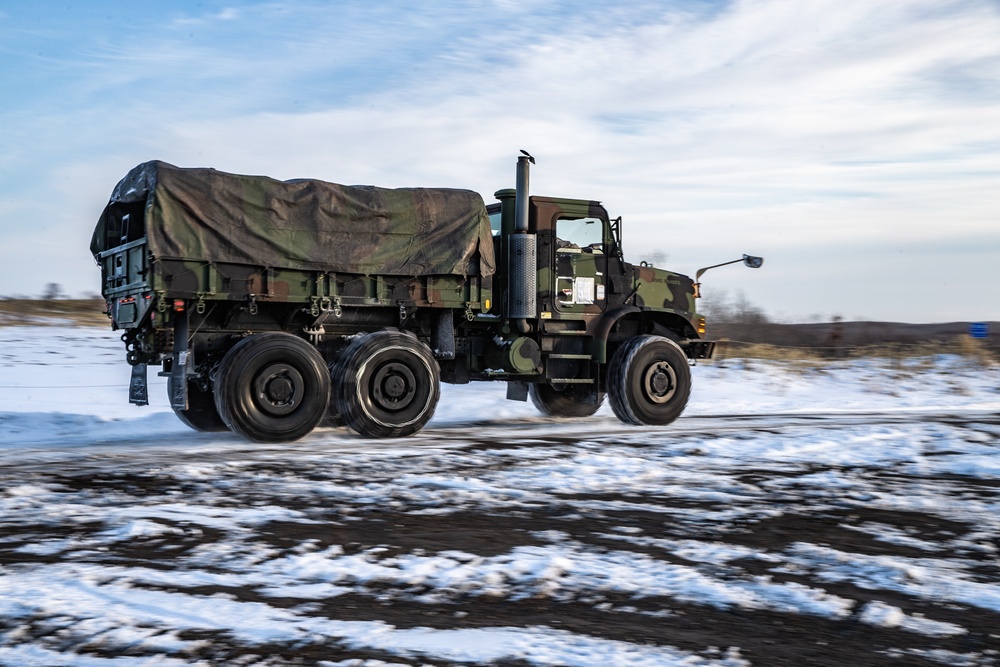 Drive Hard | U.S. Marines assigned to the Logistics Command Element maneuver vehicles through snow, an harsh terrain