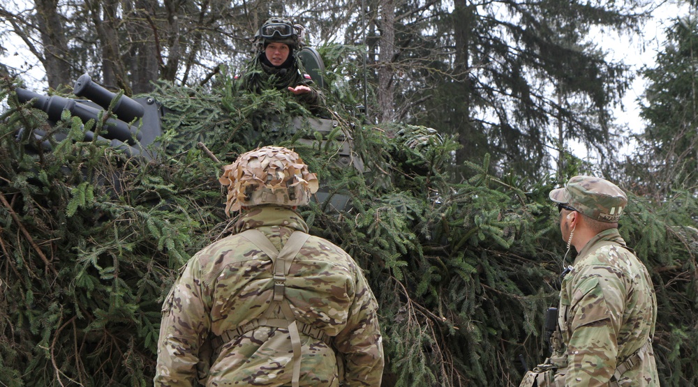 Polish Soldier works with American Troops