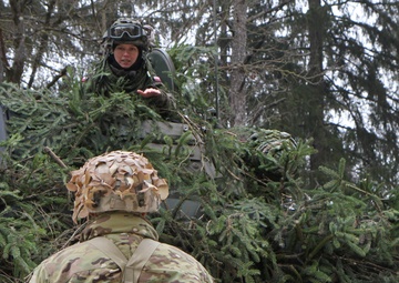 Polish Soldier works with American Troops