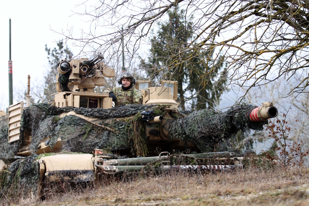 US Soldier surveys from tank at Combine Resolve XIII