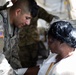 546th Area Support Medical Company Soldier bandages role player in Exercise Sudden Response 20