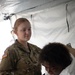 546th Area Support Medical Company Soldier Assists Role Player in Exercise Sudden Response 20