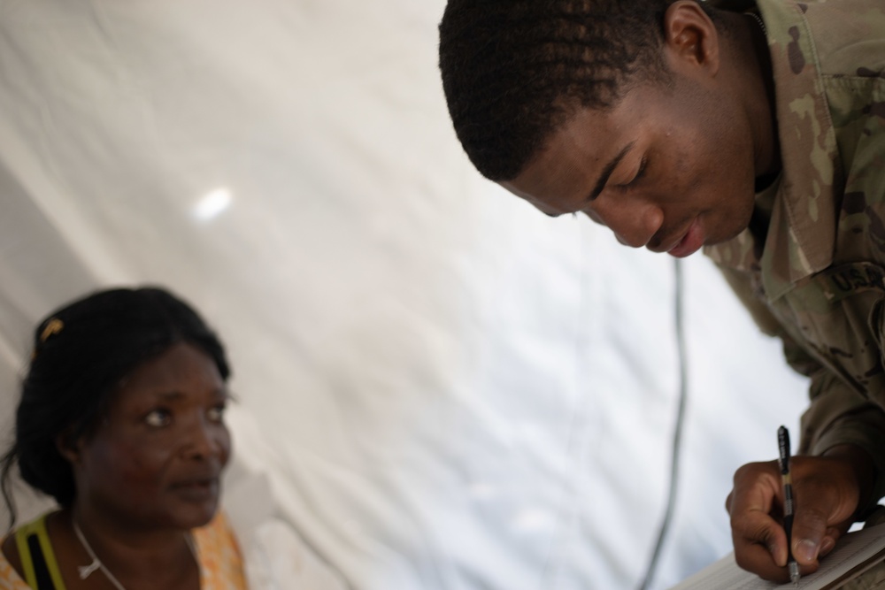 546th Area Support Medical Company Soldier Writes Medical Status during Exercise Sudden Response 20