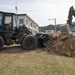 U.S. Navy Seabees repair a seawall on board Naval Base White Beach