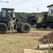 U.S. Navy Seabees repair a seawall on board Naval Base White Beach