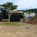 U.S. Navy Seabees repair a seawall on board Naval Base White Beach