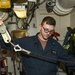 USS Normandy Sailor Inspects Rescue Equipment