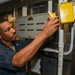USS Normandy Sailor Performs Routine Maintenance