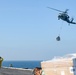 USS Harry S. Truman (CVN 75) conducts a replenishment-at-sea in the Arabian Sea